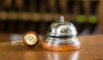 Reception - Hotel bell and key lying on the desk